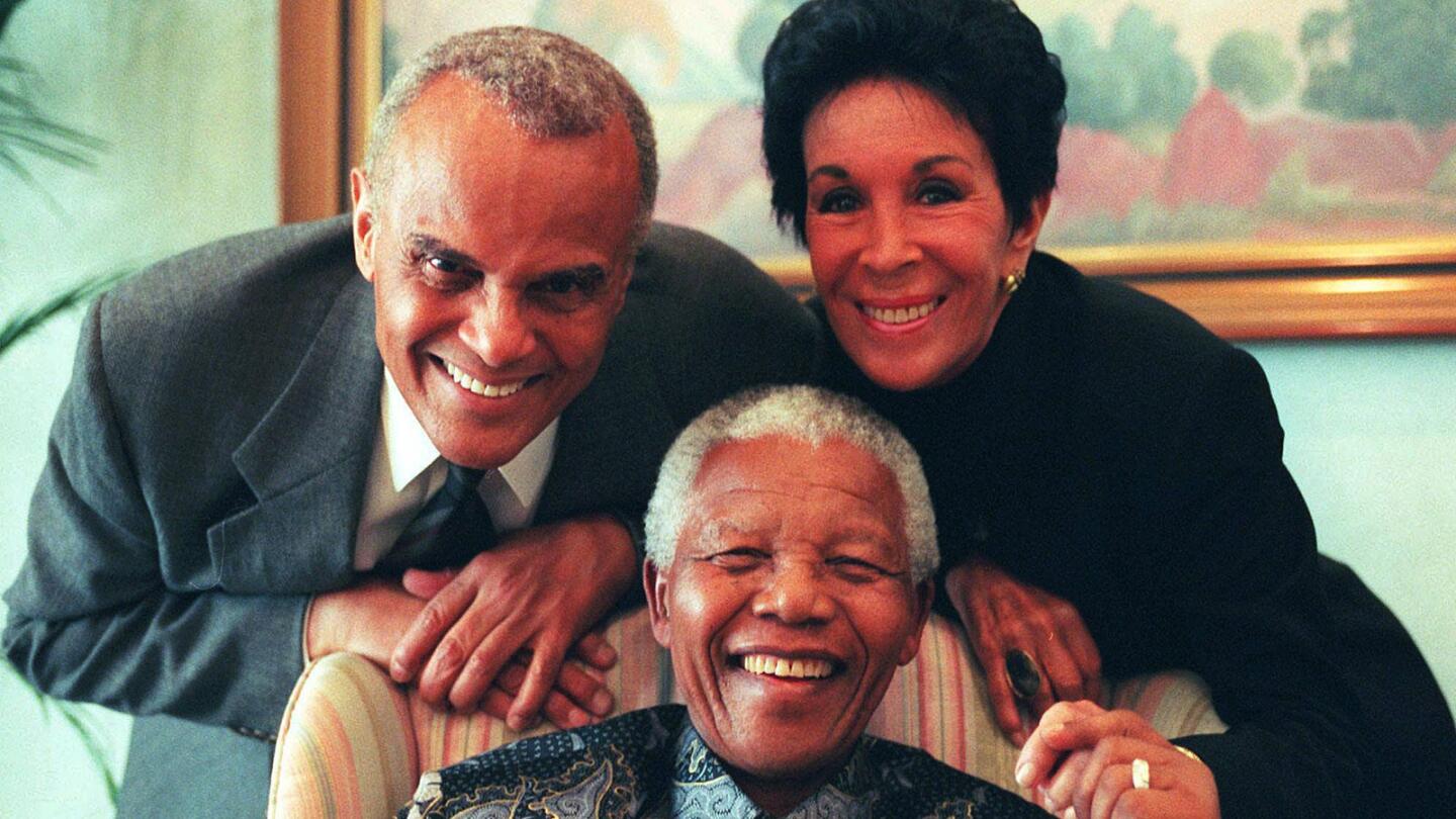 Harry Belafonte with his wife, Julie, and former South African President Nelson Mandela in Pretoria in 1999.