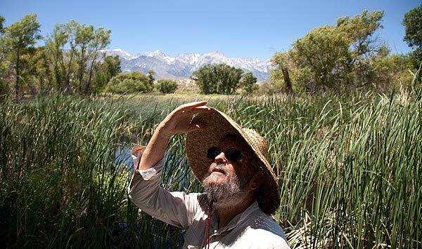 Mike Prather, an environmental activist, spends time at the Lower Owens River, which has been overrun by cattails, cane and bulrushes. See full story