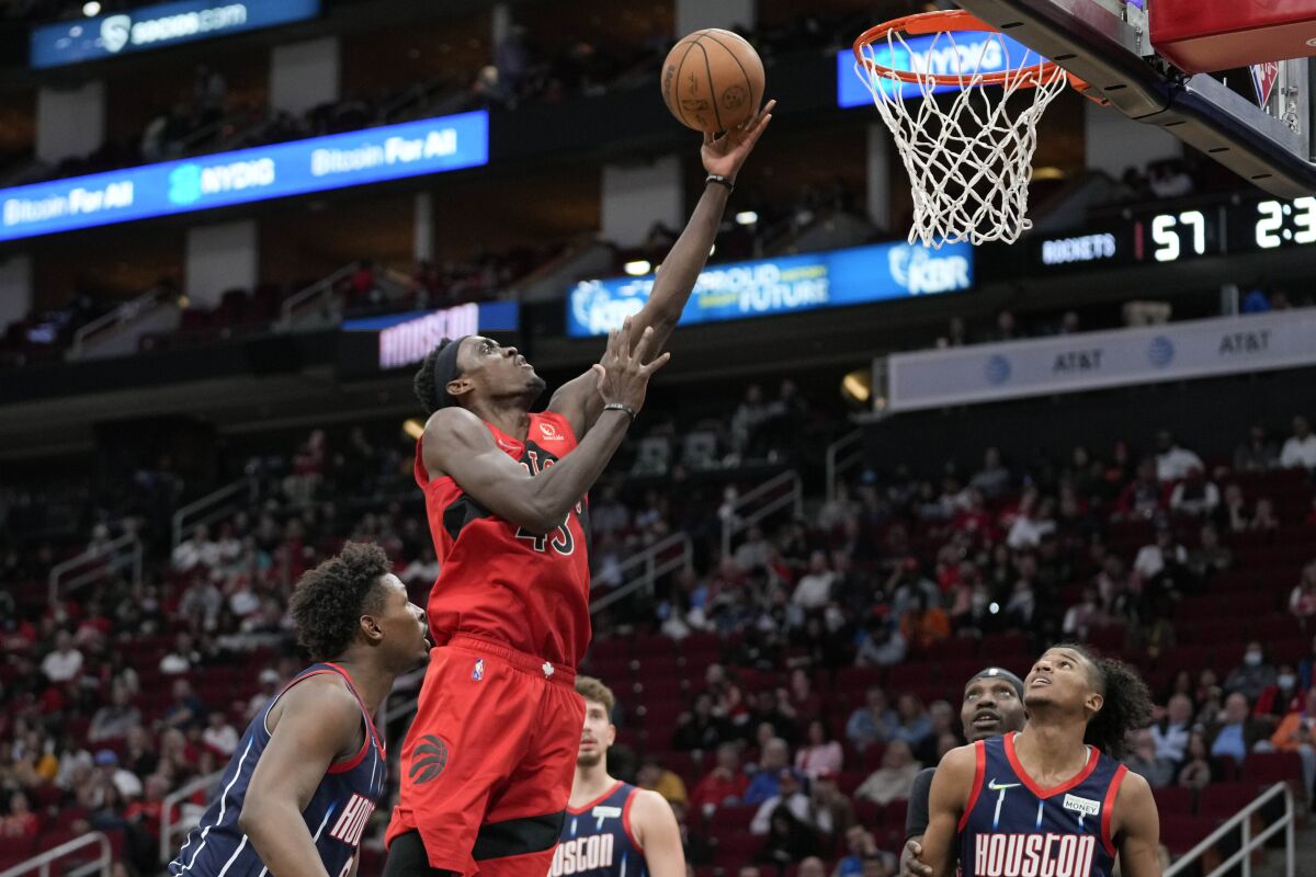 Toronto Raptors forward Pascal Siakam shoots during the first half of the team's NBA basketball game against the Houston Rockets, Thursday, Feb. 10, 2022, in Houston. (AP Photo/Eric Christian Smith)