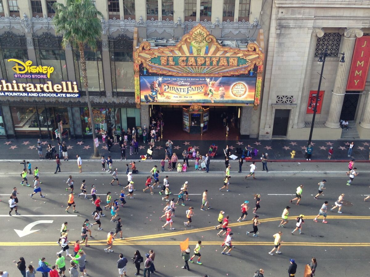 Los Angeles Marathon runners make their way down Hollywood Boulevard.