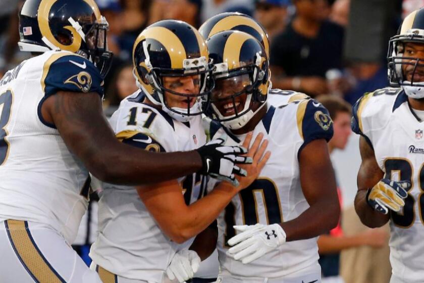 Rams quarterback Case Keenum (17) celebrates with Pharoh Cooper after the wide receiver's 11-yard touchdown catch against the Kansas City Chiefs on Aug. 20.