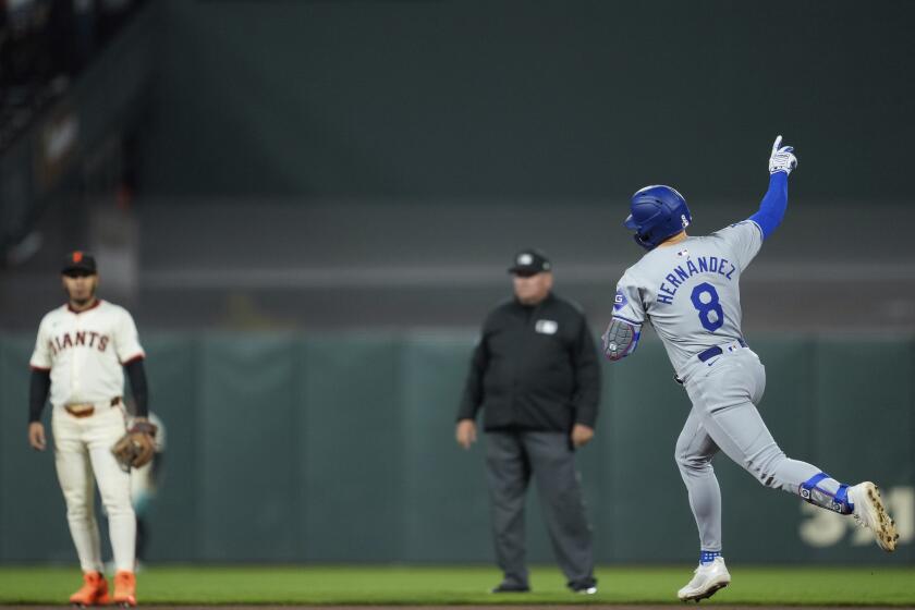 Kiké Hernández runs the bases after hitting a solo home run to tie the score in the seventh inning Monday.