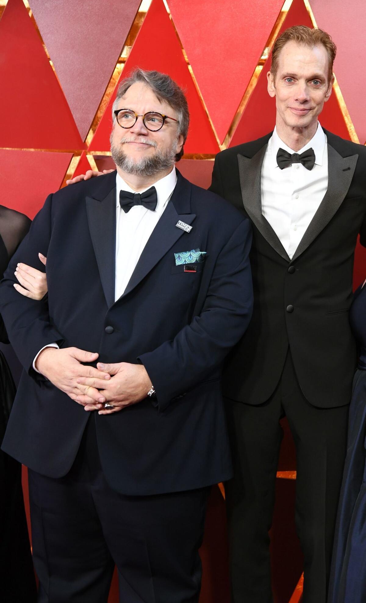 Guillermo del Toro, left, arrives with Doug Jones at the 90th Annual Academy.