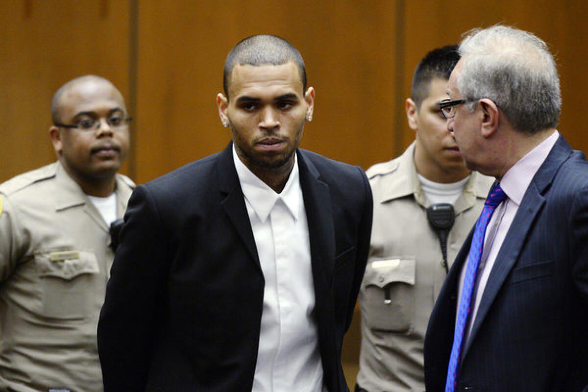 R&B; singer Chris Brown appears in an L.A. court with attorney Mark Geragos for a probation hearing on Aug. 16.