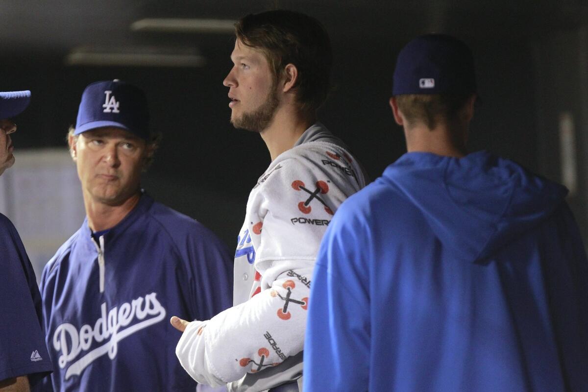 Dodgers Manager Don Mattingly, left, isn't about to endorse ace Clayton Kershaw as his pick for the National League MVP.