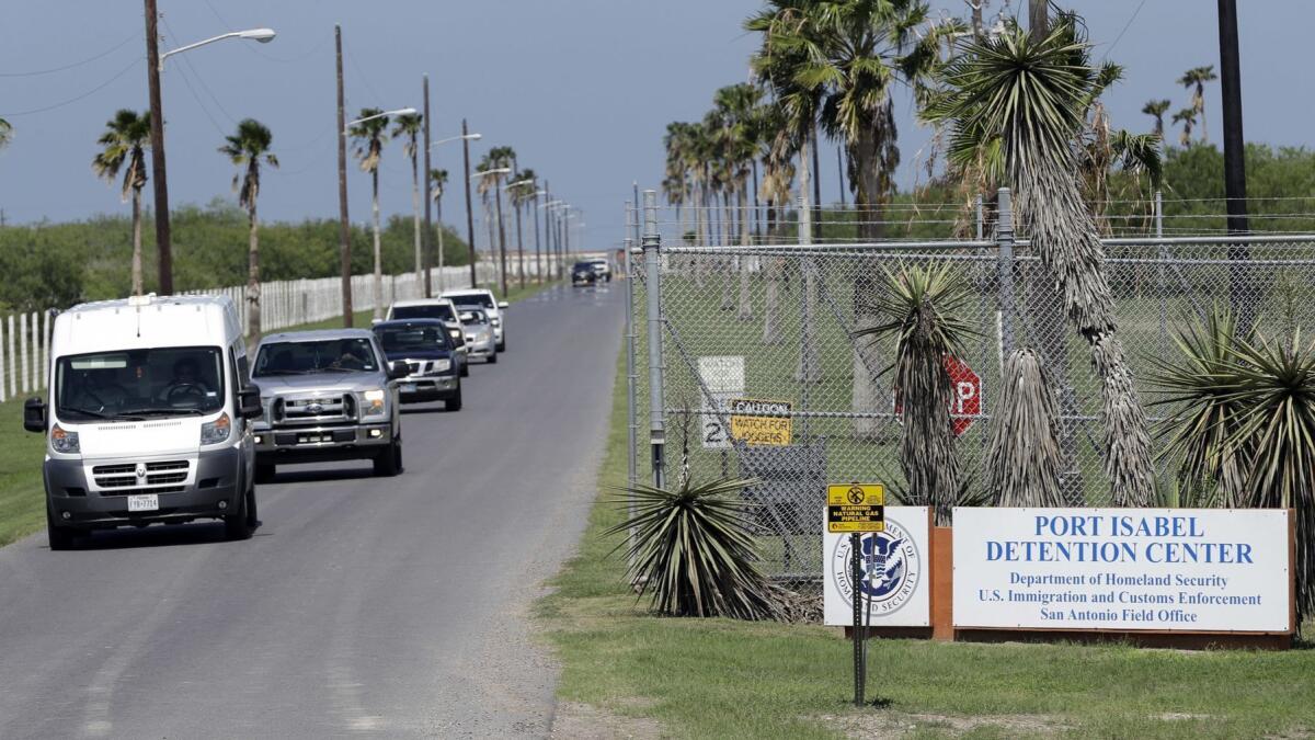 Vehicles leave the Port Isabel Detention Center, which holds detainees of Immigration and Customs Enforcement.
