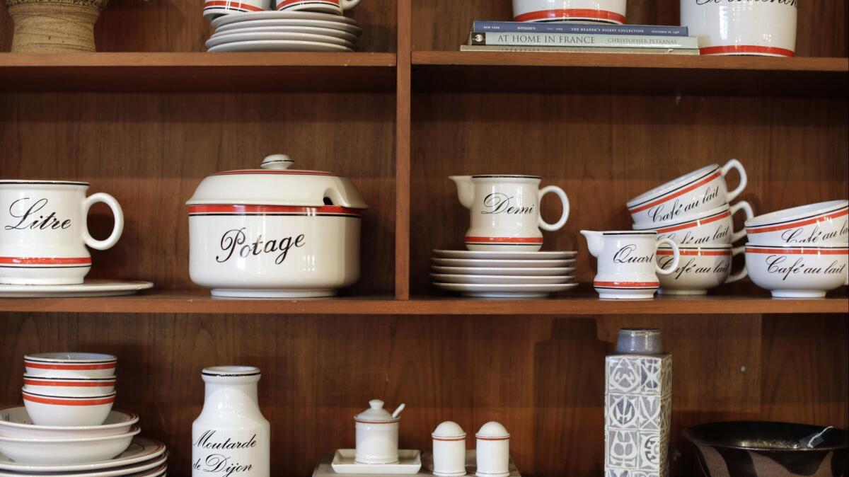 Assorted French cafe-style dinnerware with French words in script on them