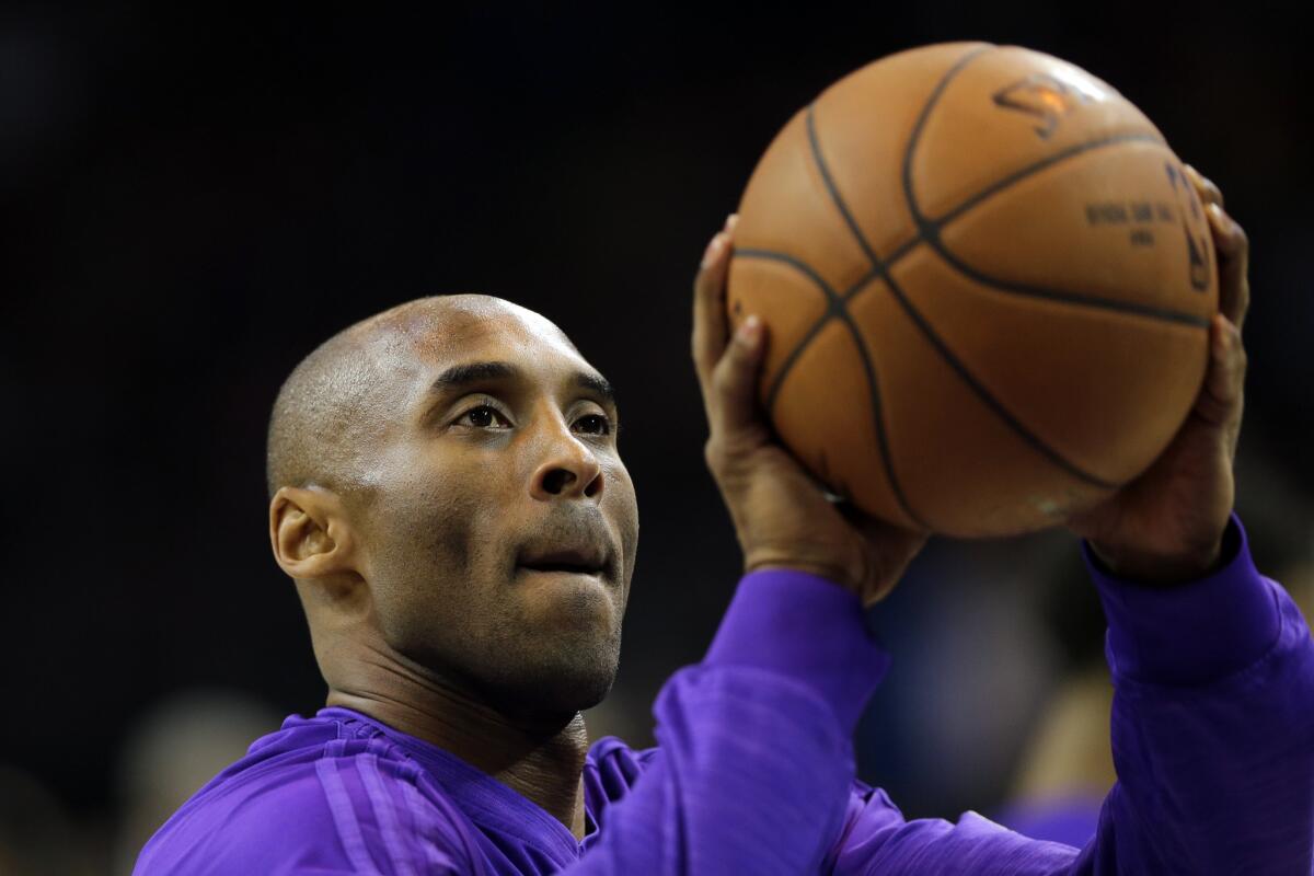 Kobe Bryant practices his shot before a Dec. 1 game against the 76ers in Philadelphia.