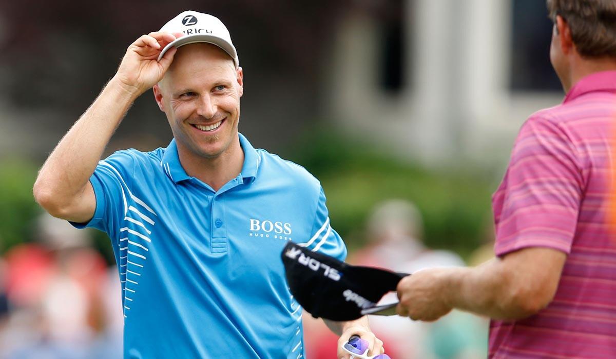 Ben Crane, left, is congratulated by playing partner Retief Goosen after winning the FedEx St. Jude Classic on Sunday.