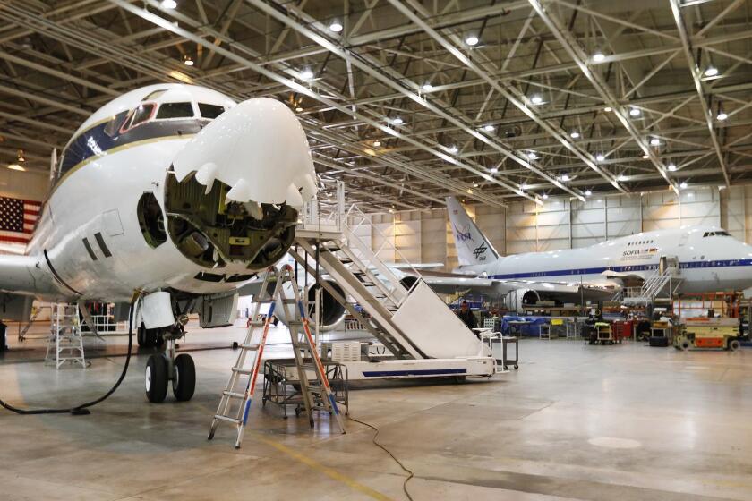 PALMDALE, CA - FEBRUARY 7, 2019 A NASA-operated DC-8 stationed in Palmdale California used to collect and analyze atmospheric samples from around the world in its hangar between missions on February 7, 2019. The plane can be loaded with cutting edge equipment and when running at full capacity, hosts roughly three dozen scientists and engineers, and a crew of eight, as it roams the planet. (Al Seib / Los Angeles Times)