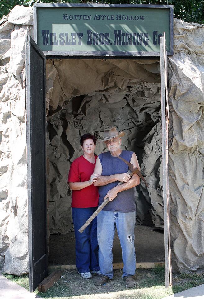 Diane and Preston Meyer stand at the corner of their Burbank home property at the theshold to the silver mine entrance of the Rotton Apple Hollow haunted house they are building on Tuesday, October 20, 2015. This is the Meyer's 25th year making a haunted house, evolving from a tour through their home to an elaborate, self-built project derived from plans that start getting conceptualized in January.