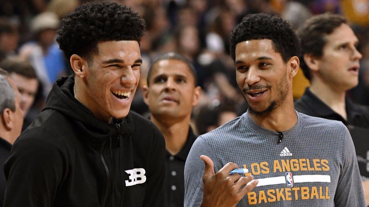 Lakers' Lonzo Ball, left, and Josh Hart watch teammates warm up before the championship game of the 2017 Summer League against the Portland Trail Blazers on July 17.