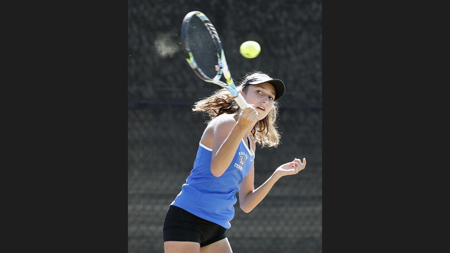 Burbank's Kristina Kirakosyan hits a forehand return against Arcadia in the Pacific League girls' tennis semifinals at Burroughs High School on Wednesday, October 25, 2017.
