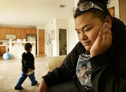 Susana Tupou sits in the family room of her Stockton home, her eyes fixed on the spot where her mother lay dying a year ago.