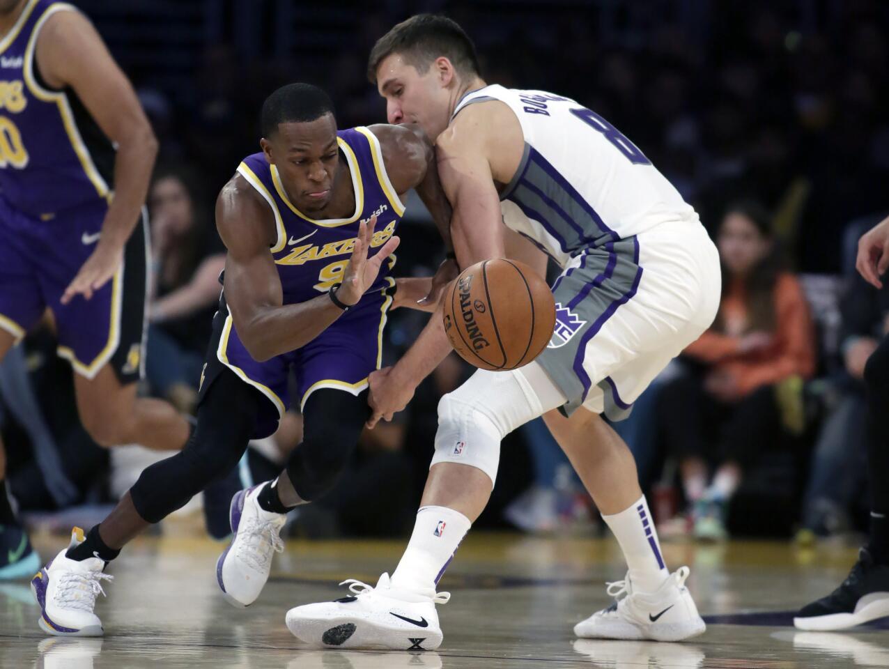 Lakers guard Rajon Rondo, left, steals the ball from Sacramento Kings guard Bogdan Bogdanovic.