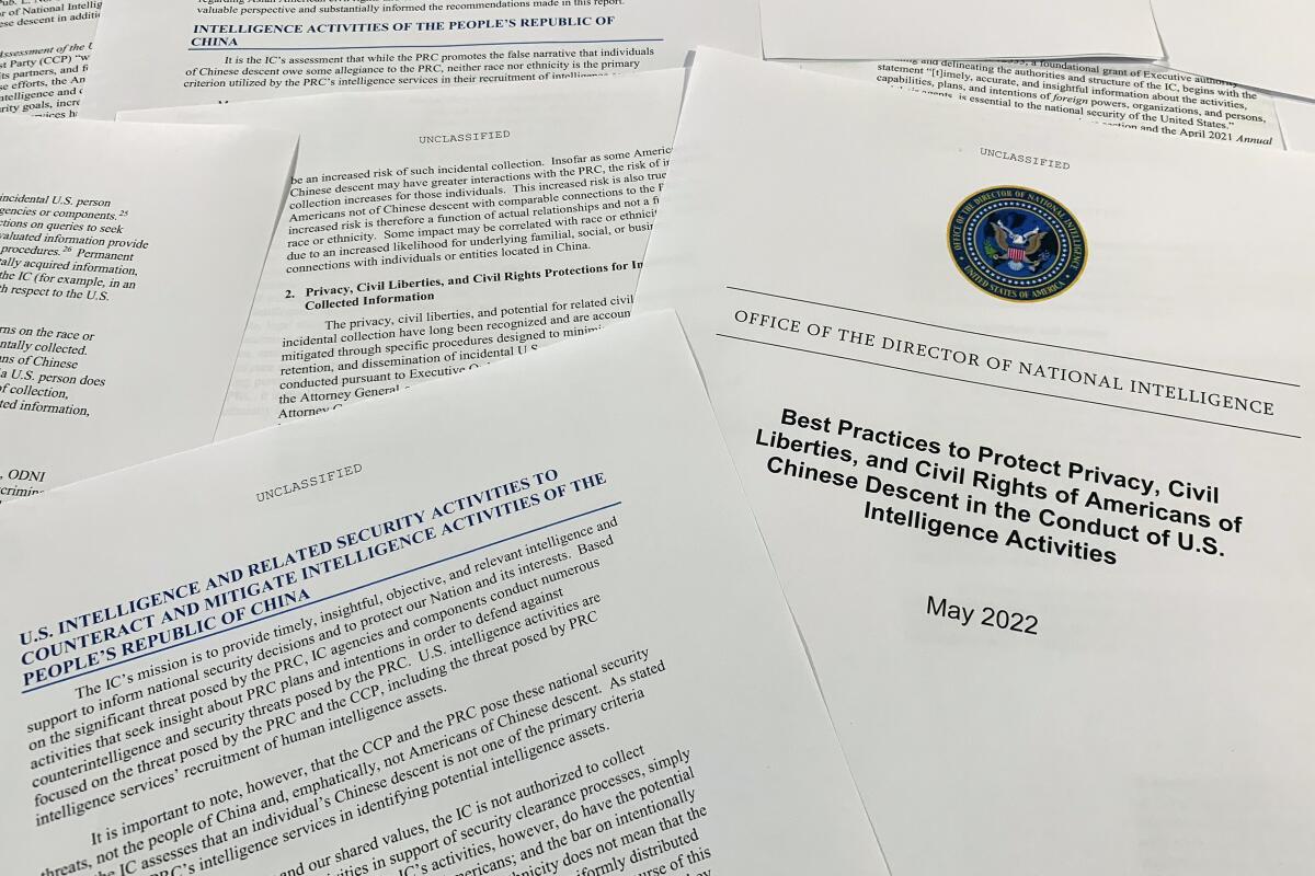 A report issued by the Office of the Director of National Intelligence is photographed in Washington, June 14, 2022. As America's intelligence agencies ramp up efforts against China, top officials acknowledge they may also end up collecting more phone calls and emails from Chinese Americans, raising new concerns about spying affecting civil liberties. The new report makes several recommendations, from expanding unconscious bias training to reiterating internally that federal law bans targeting someone solely due to their ethnicity. (AP Photo/Jon Elswick)
