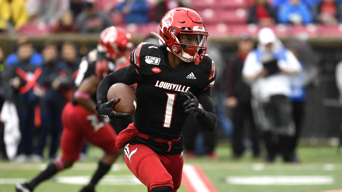 Louisville wide receiver Tutu Atwell runs with the football.