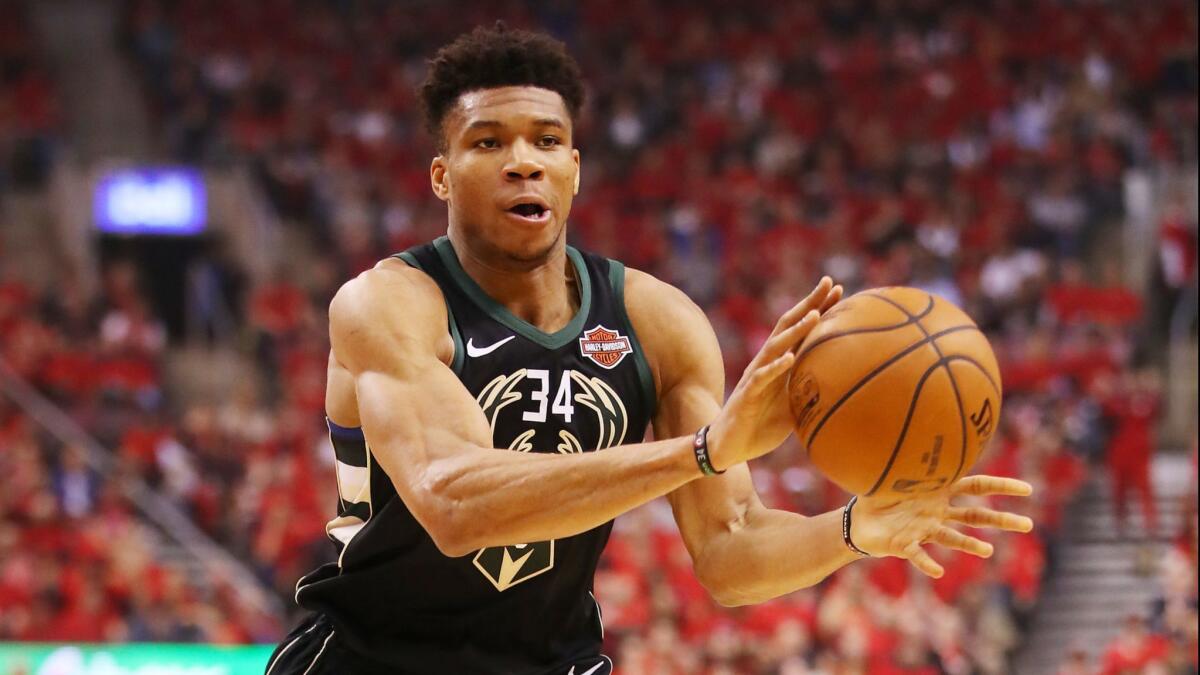Giannis Antetokounmpo makes a pass against the Toronto Raptors on May 25.