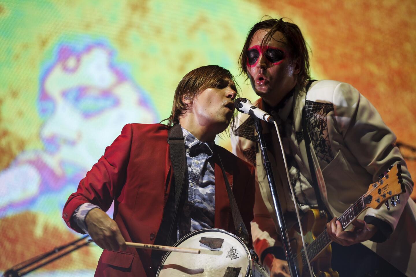 Arcade Fire performs as the closing act on the Coachella Stage, on the third and final day of the second weekend of the Coachella Valley Music and Arts Festival, 2014.