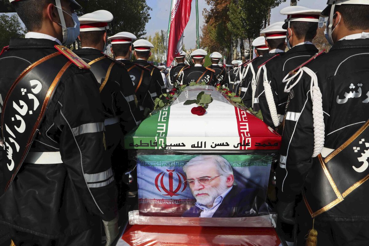 Military personnel near the flag-draped coffin of Mohsen Fakhrizadeh-Mahabadi.