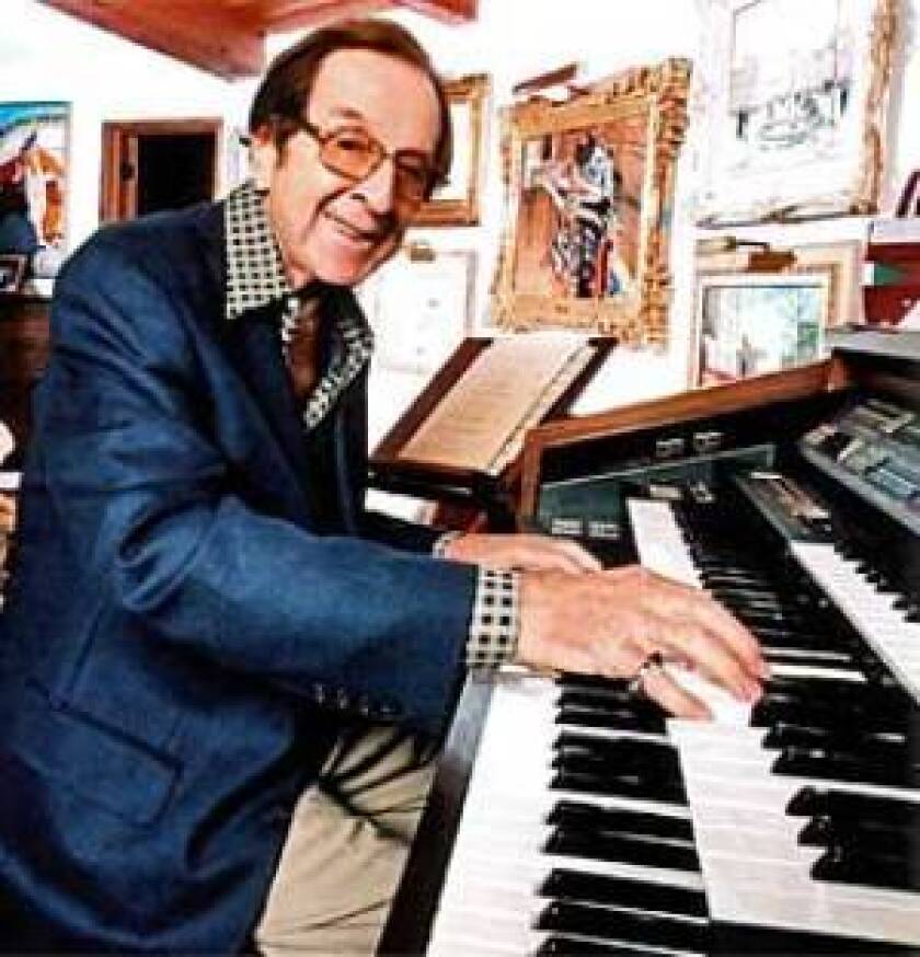 Vic Mizzy at his home in Bel Air. "Two finger snaps and you live in Bel-Air," Mizzy once said, referring to his success with the "Addams Family" song.