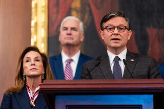 House Speaker Mike Johnson speaks about the shutdown at a news conference Thursday with other Republican House members.