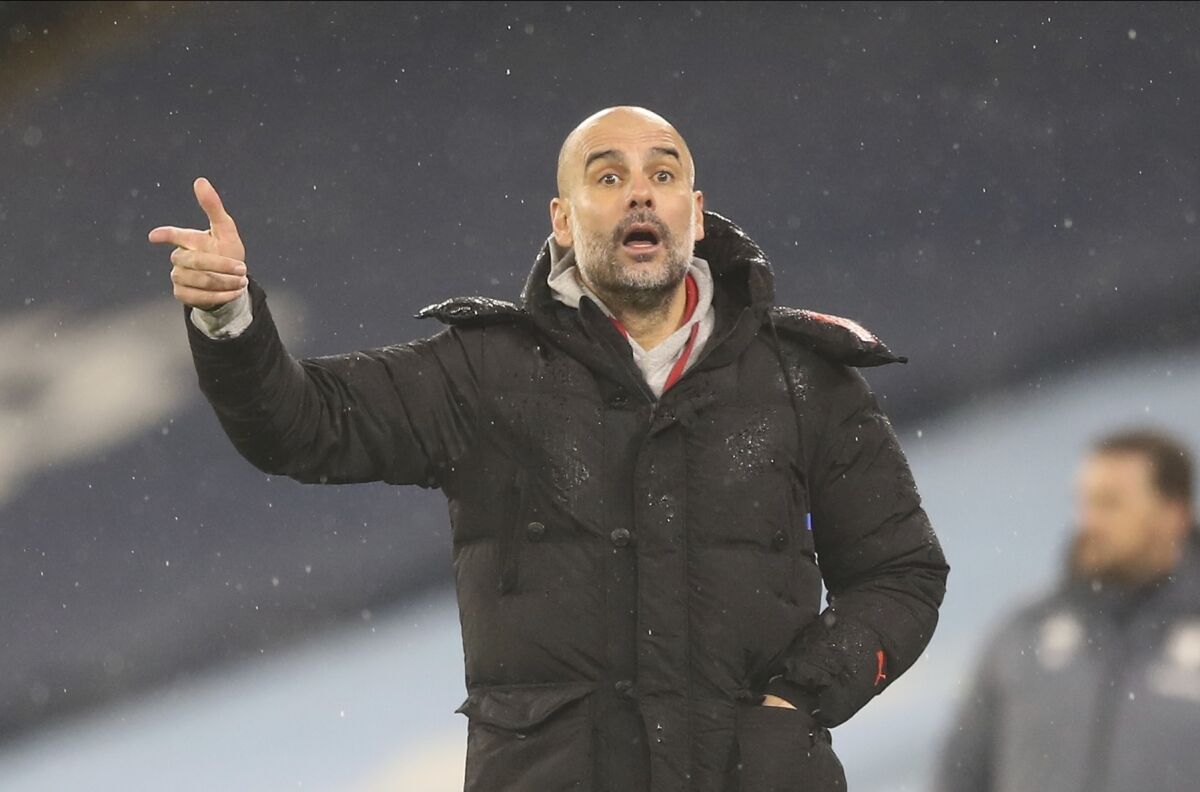 Manchester City manager Pep Guardiola gives instructions from the sidelines