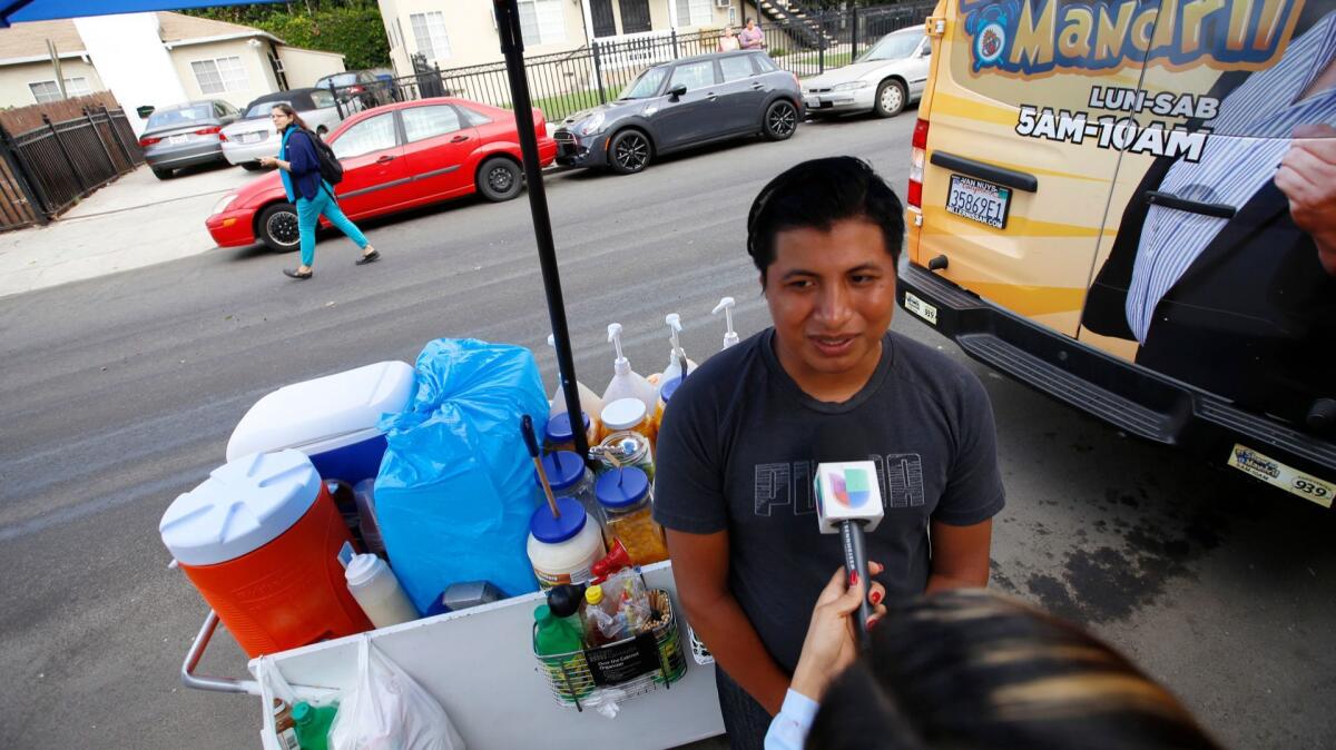 Benjamin Ramirez is interviewed by local media as supporters arrive near the location where the confrontation took place.