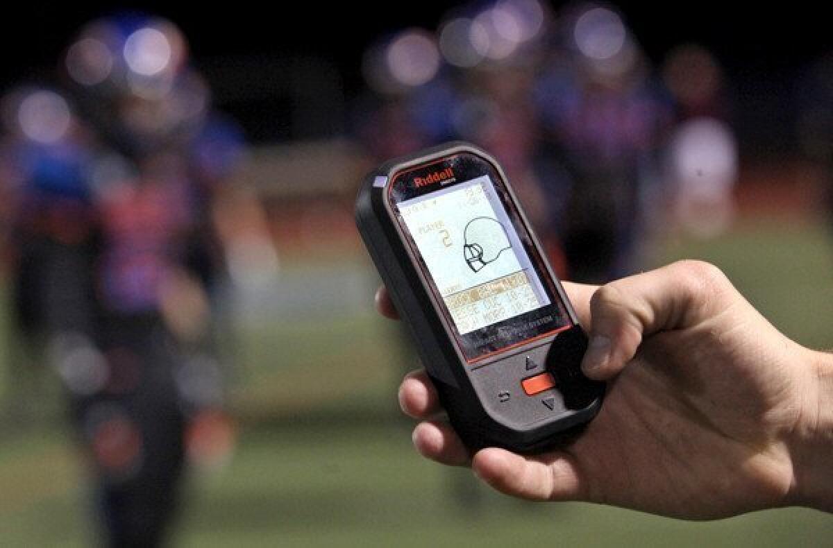 New technology by helmet-manufacturer Riddell uses sensors to report hard, potentially concussion-causing hits to a handheld digital device on the sideline.