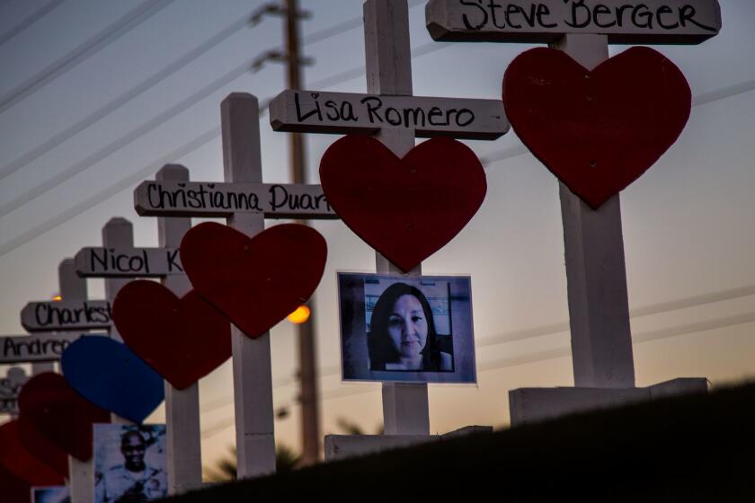 LAS VEGAS, NV - OCTOBER 5, 2017: Wooden crosses bearing the names of those killed during Sunday's mass shooting line the median near the Welcome to Las Vegas sign off Las Vegas Boulevard on October 5, 2017 in Las Vegas, Nevada. Greg Zanis of Illinois drove all night to deliver the homemade crosses.(Gina Ferazzi / Los Angeles Times)