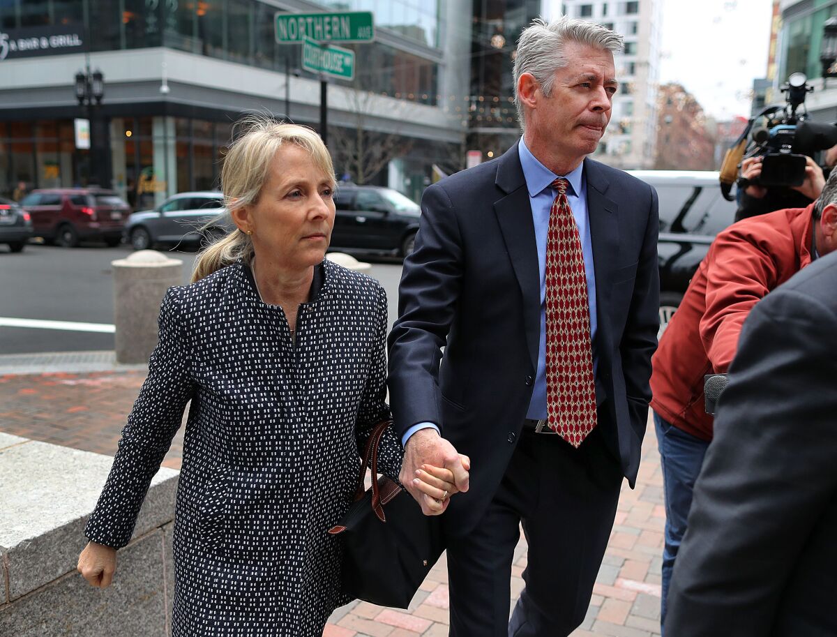 Elisabeth Kimmel and her husband arrive at the federal courthouse in Boston on March 29, 2019.