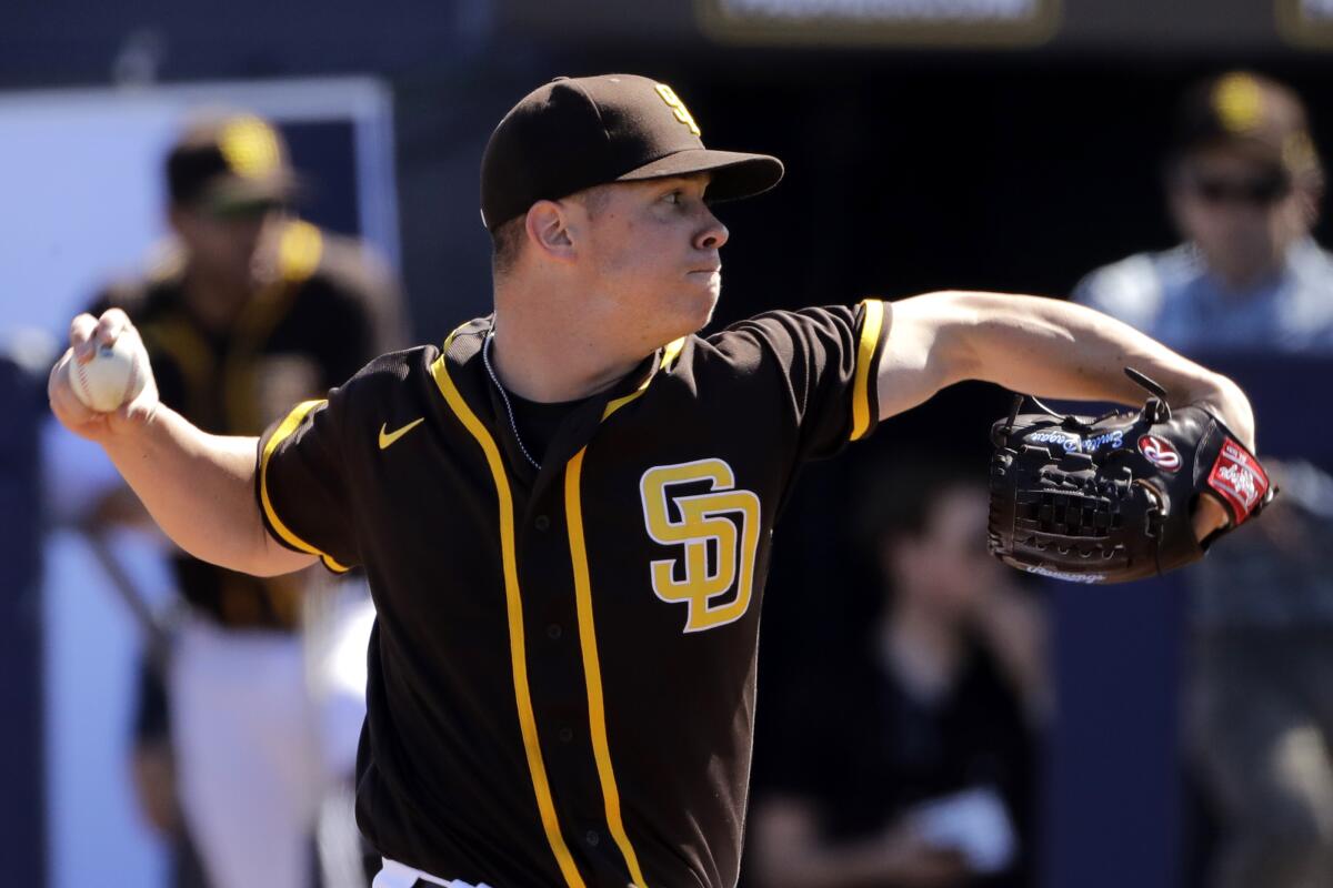 San Diego Padres' Manny Machado strikes out against the San Francisco  Giants during the second inning of a spring training baseball game,  Saturday, March 2, 2019, in Peoria, Ariz. (AP Photo/Matt York