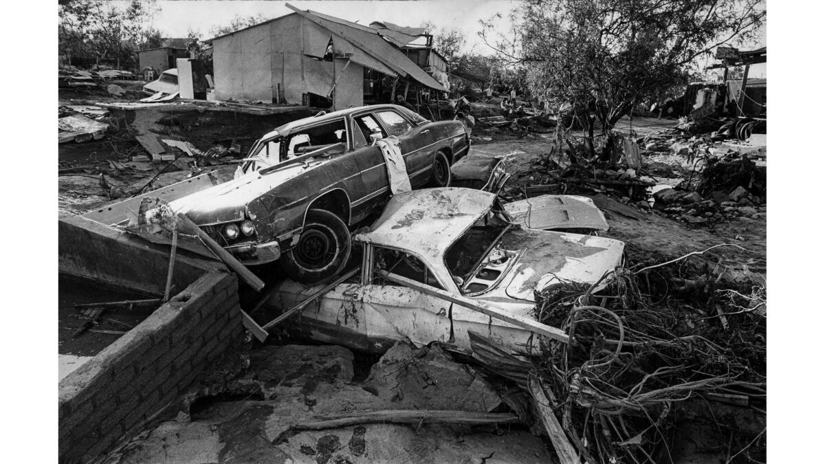 Oct. 2, 1976: Car rests on top of second in aftermath of Hurricane Liza that lashed La Paz, Mexico.