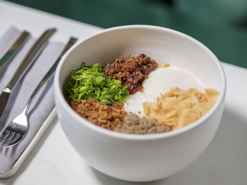 The congee at Nightshade is served with XO sauce, pork floss and an onsen egg.