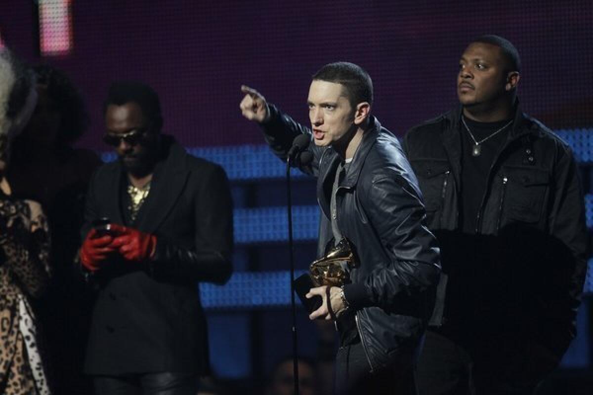 Eminem collects a Grammy Award at Staples Center in February 2011. The company that licenses his songs says Facebook infringed on its copyright.