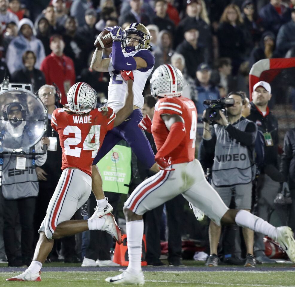 Washington wide receiver Aaron Fuller makes a catch against Ohio State defensive back Shaun Wade in the fourth quarter of the Rose Bowl on Jan. 1.