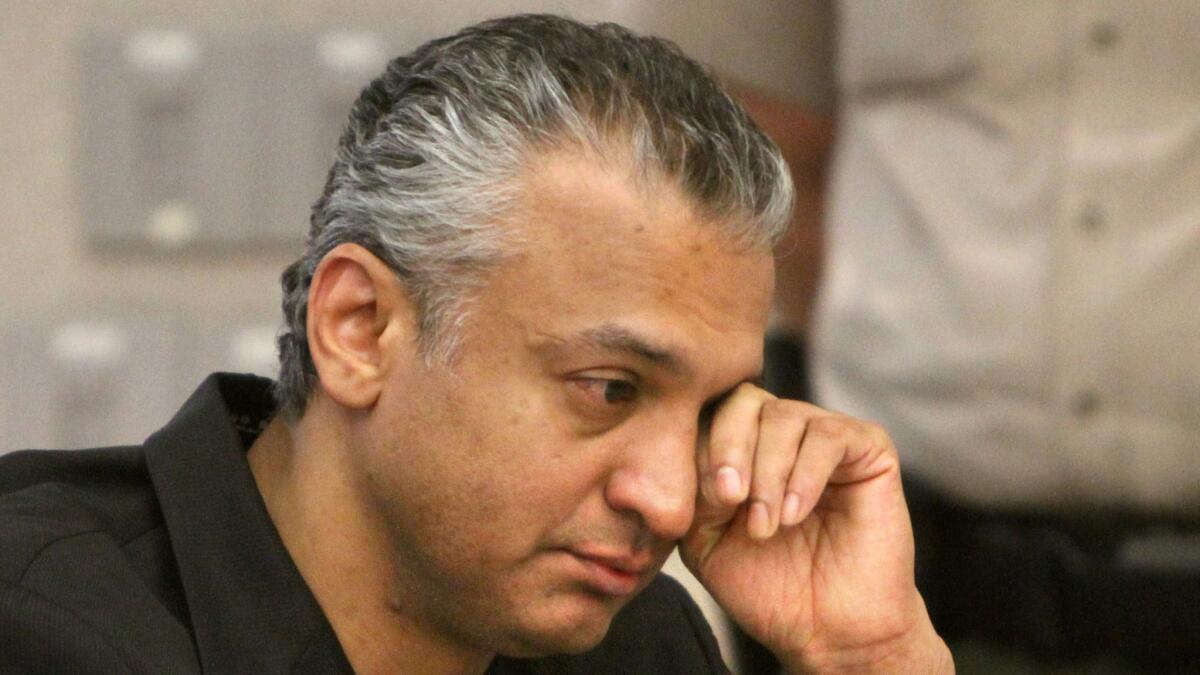 Shelley Malil, who had a small role in the movie “The 40-Year-Old Virgin,” wipes tears during his sentencing hearing in Vista in 2010.