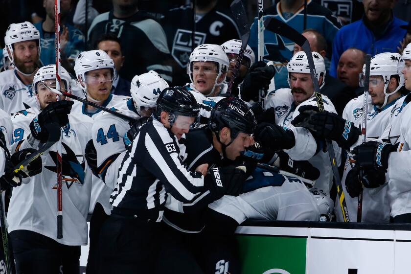 Milan Lucic is surrounded by San Jose players during a fight on Thursday night.