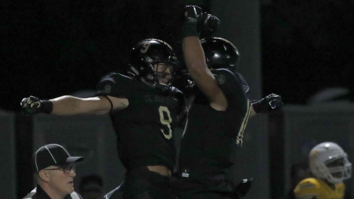 Bosco wide receiver Colby Bowman (9) celebrates after making a touchdown catch against Mililani.