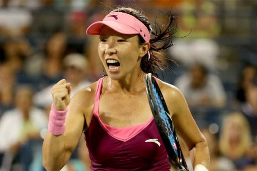 Zheng Jie of China celebrates during her 6-3, 2-6, 7-6 (5) victory over Venus Williams during the second round of the U.S. Open on Wednesday.