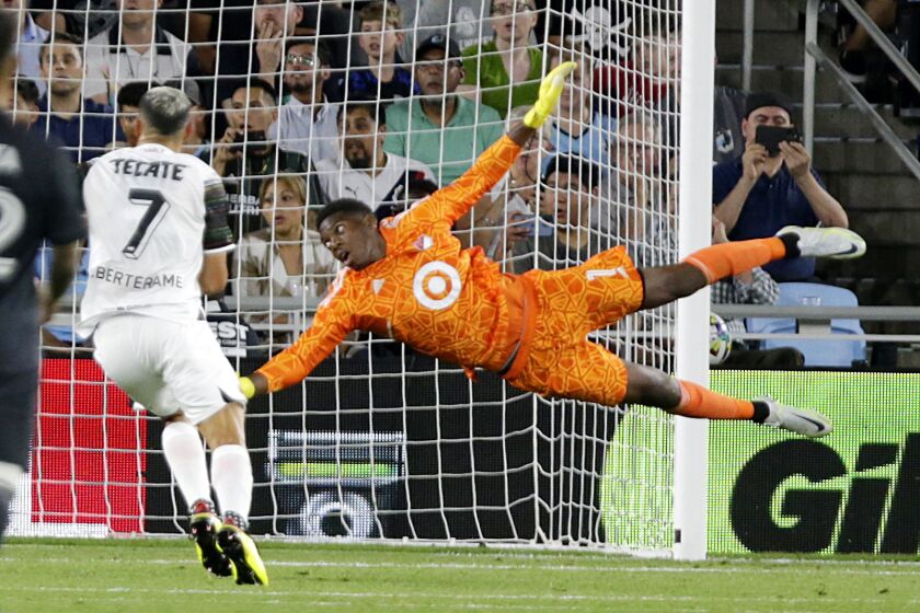 FILE - MLS All-Star goalkeeper Sean Johnson (1) dives for the ball as Liga MX All-Star Sebastián Driussi watches during the second half of the MLS All-Star soccer match Wednesday, Aug. 10, 2022, in St. Paul, Minn. Sean Johnson is the new goalkeeper for Toronto FC through 2024. The 33-year-old free agent spent the last six seasons with New York City FC.(AP Photo/Andy Clayton-King, File)