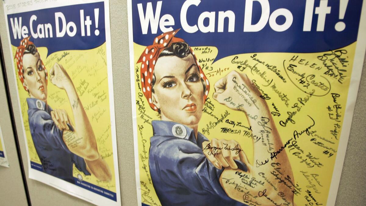 A former Burbank city manager writes Burbank should honor civilian aviation workers in the planned airport terminal. A poster of Rosie the Riveter is seen at the offices of the Rosie the Riveter/World War II Home Front National Historic Park in Richmond, Calif.