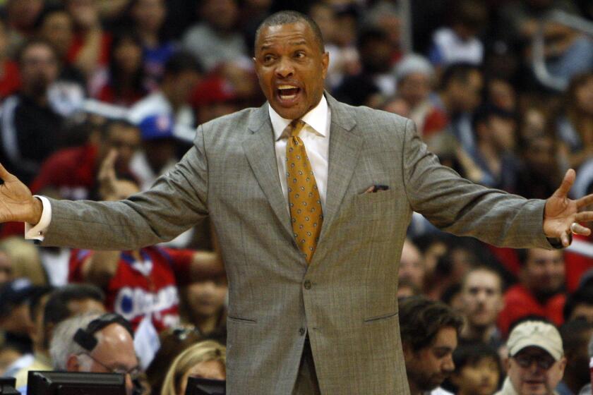 Then-Phoenix Suns coach Alvin Gentry argues with an official during a game against the Lakers in 2012. Gentry, who serves an associate head coach under Clippers Coach Doc Rivers, has drawn interest from NBA teams with coaching vacancies.