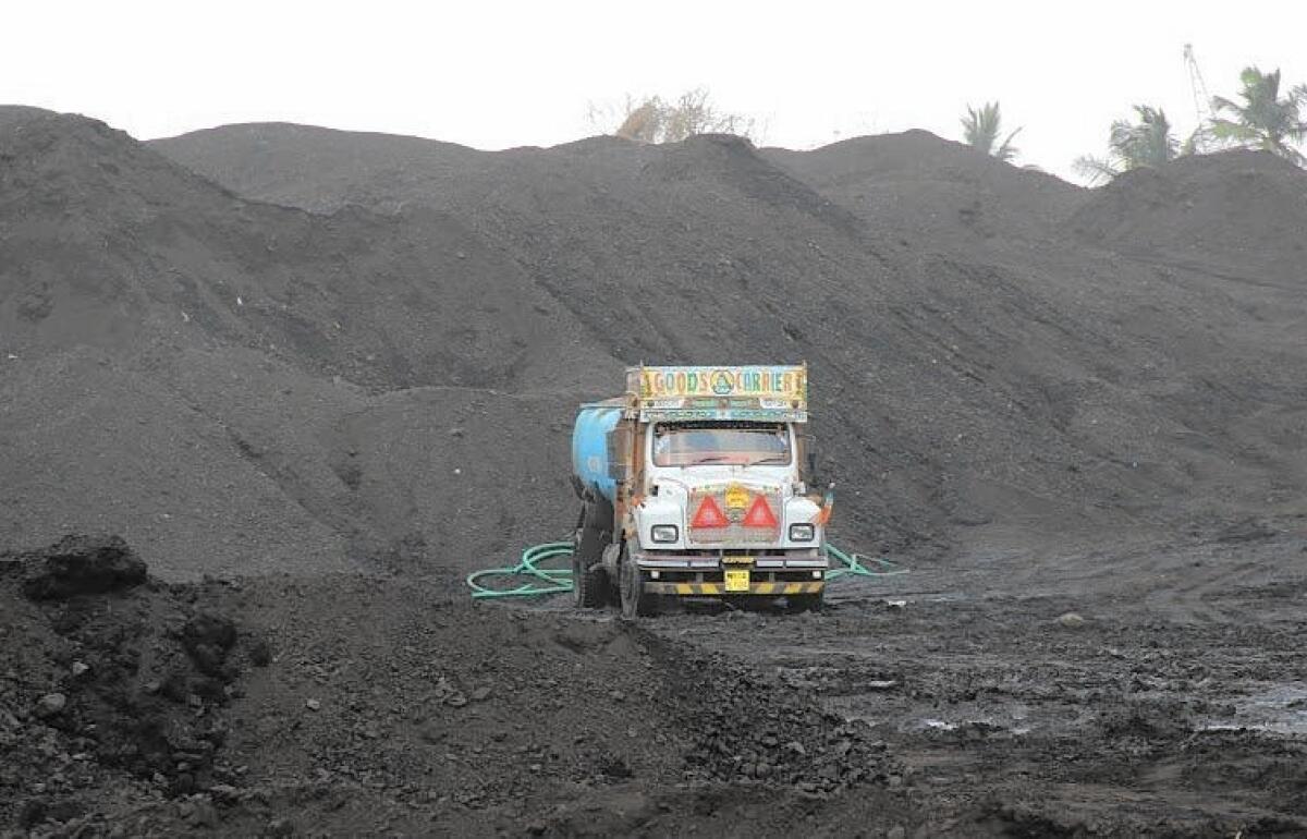 The Haji Bunder coal site in Mumbai, India. Critics say the mountains of coal, imported from Indonesia and Australia, are causing health and environmental problems.