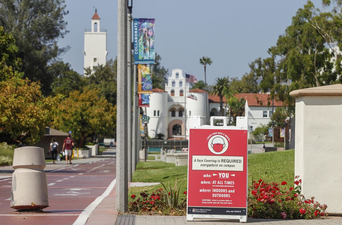 A sign warns students and others on campus to wear a mask at SDSU on Wednesday.