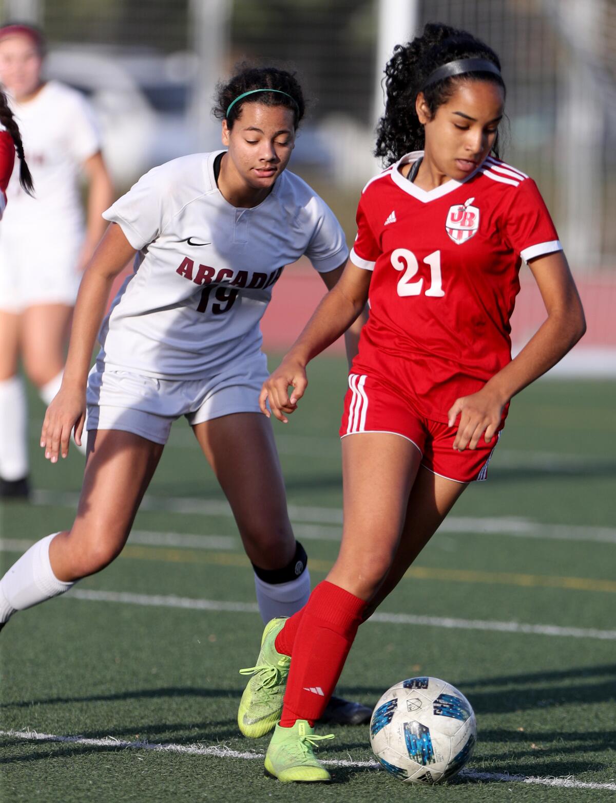 Burbank girls soccer player Lauryn Bailey, right, controls the ball in game vs. Arcadia, at home in Burbank on Tuesday, Jan. 7, 2020.