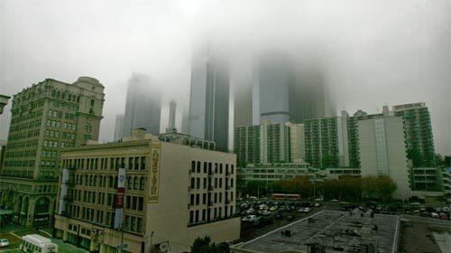 STORM: Clouds move into downtown Los Angeles, obscuring the city center as rain showers roll through Southern California.