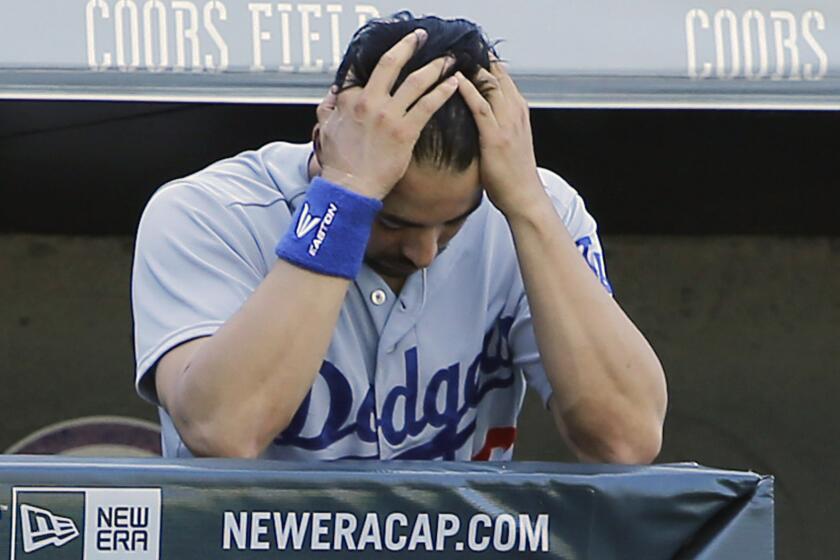 Dodgers outfielder Andre Ethier reacts during the seventh inning of a 16-2 loss to the Colorado Rockies on Wednesday.