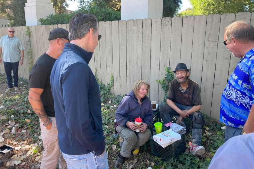 Gov. Gavin Newsom speaks to the homeless