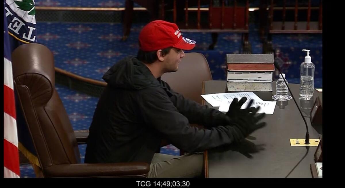 Christian Secor sits behind the dais on the floor of the Senate on Jan. 6, 2021.